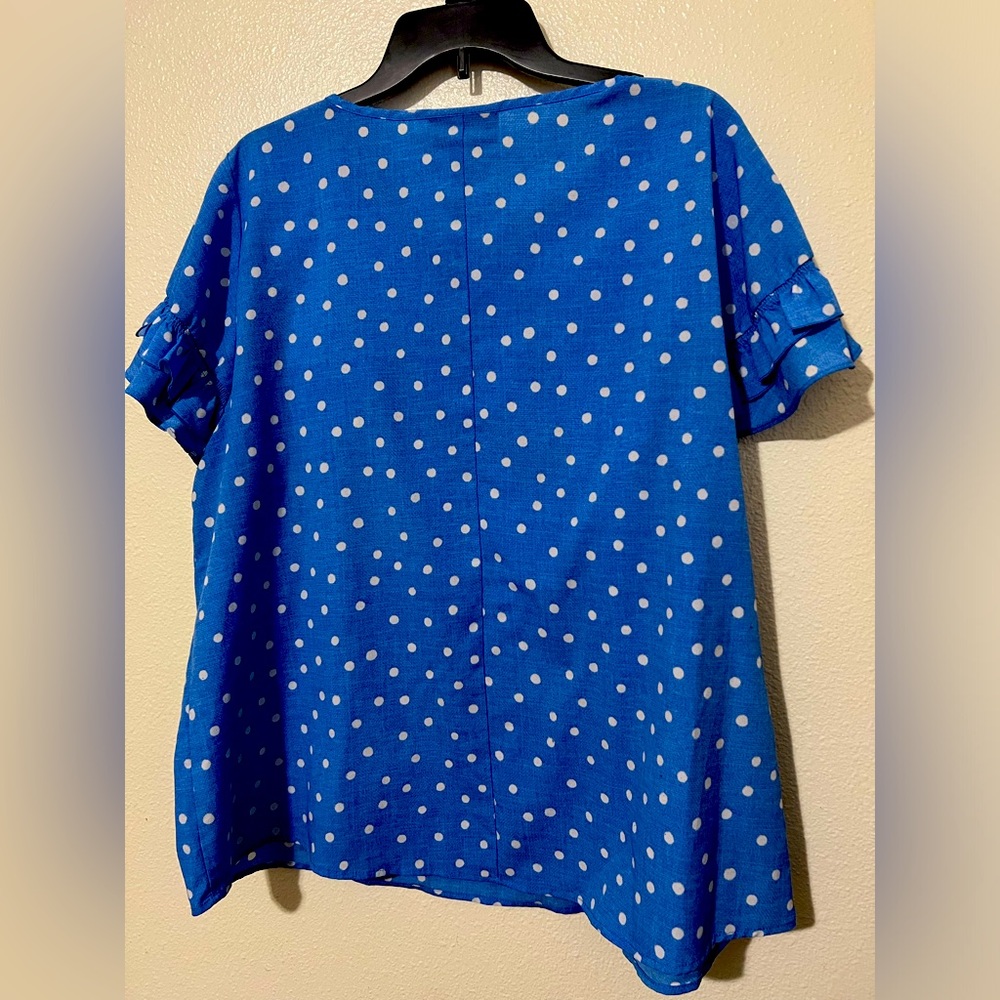 Blue and white polka dot blouse